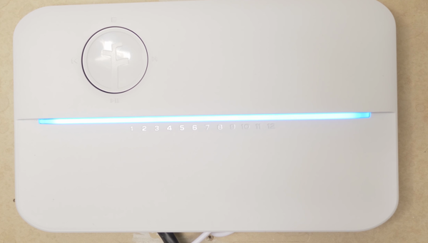 Rachio 8 zone smart sprinkler controller, works with alexa attached to wall